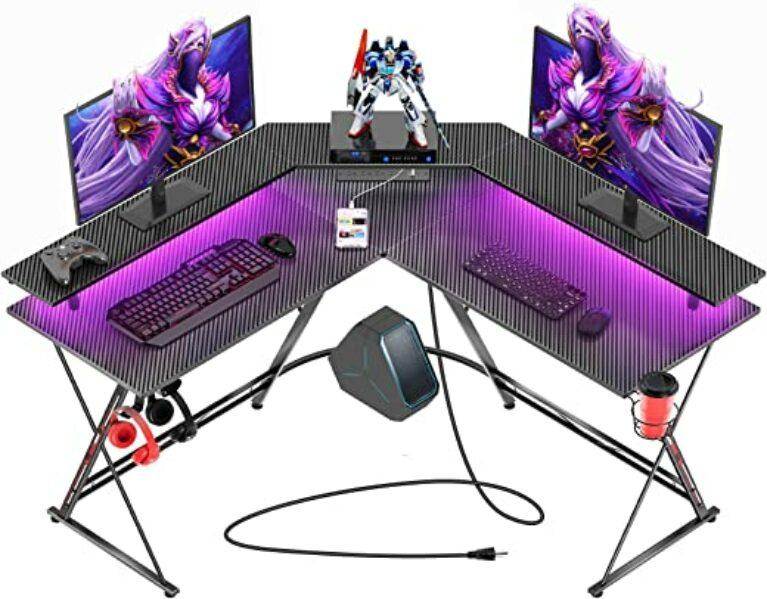 SEVEN WARRIOR Gaming Desk 50.4” with LED Lights & Power Outlets, L-Shaped Gaming Desk Carbon Fiber Surface with Monitor Stand, Ergonomic Gamer Table with Cup Holder, Headphone Hook, Black